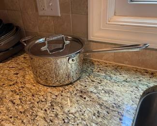 K8 - $85. All-Clad D5 Stainless Pot with Lid. 4 qt. Pot is 5" tall.
