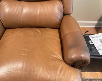 A8 - $125. Motioncraft Leather Recliner. No rips but there is some staining on the arms. Measures 38" wide x 40" deep x 39" tall.