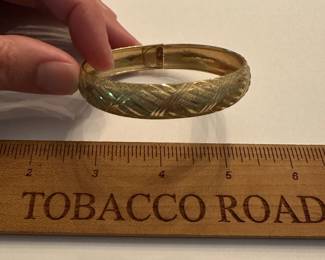J13 - $320. 10kt gold cuff bracelet with clasp.