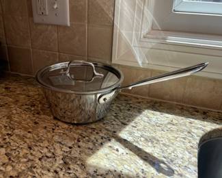K6 - $55. All-Clad Stainless D5 pot with lid. 2.5 quart. Measures 4" tall.