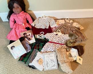 C19 - $400. Addy Walker - American Girl Doll 1993. Includes doll, Ida Bean, 6 outfits, kerosene lantern, gourd, half dime, apron (new in package). Hair has been brushed a lot but no issues noted with the doll.
