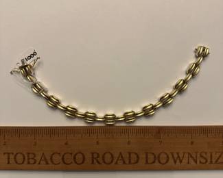 J9 - $1000. 7.5" 2 tone - reversible gold bracelet! One side is white gold and the other is yellow gold.