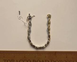 J9 - $1000. 7.5" 2 tone - reversible gold bracelet! One side is white gold and the other is yellow gold.