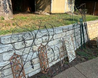 Iron garden decor, tiki torch holders, trellises 