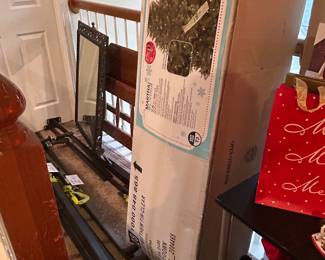 Pre-lit trees (new in box), twin bed frame, queen bed rails, wall mirror (the room past this is empty and is blocked to keep weight off this walkway)
