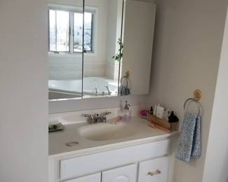 Bath vanity; mirrored medicine cabinet; vanity light