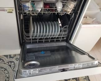 White GE dishwasher with stainless steel interior