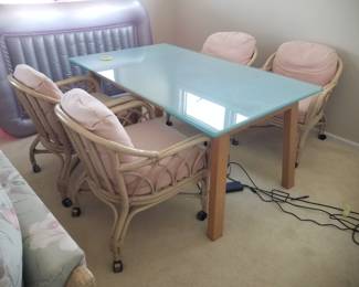 Set of 4 rattan chairs; glass top table