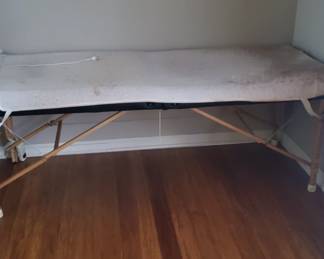 Massage bed with warmer.
Brand: Best Massage
76 inches long x 29 inches wide 
adjustable height.
$100