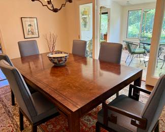 A fine Burl wood dining room set with six chairs.
