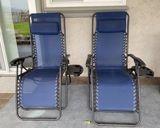 Pair of folding lounger chairs with generous side table and cup holders attached, even head pillows, guests feel pampered