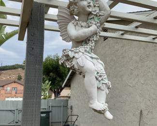 Swinging cherub to cheer up your yard