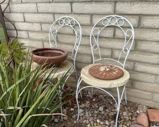 Pair patio chairs make garden stands for potted plants, may need seats to use as chairs