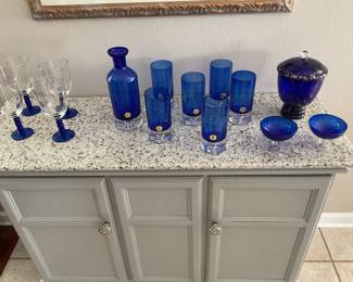 Cobalt blue glassware, detail of top of cabinet