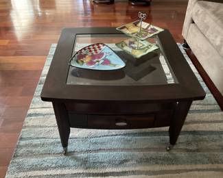 Coffee table with lower shelf, drawer on each side