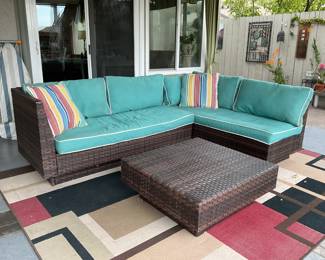 Patio set of weather resistant plastic wicker