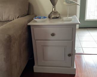 One of two end table cabinets