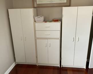 Three separate cabinets for crafts, garage cabinets, storage cabinets, you decide