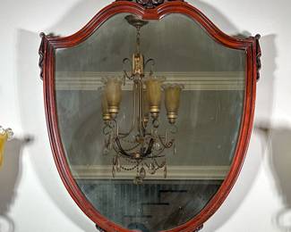 Mahogany Shield-Shaped Wall Mirror | Antique (1930s) carved mahogany shield-shaped wall mirror with finial detail on top. - h. 38 x w. 30 x d. 1 in