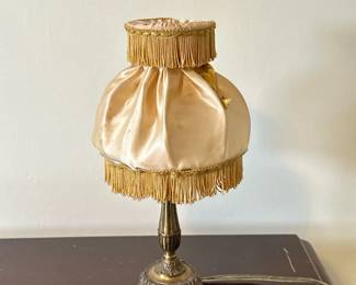 Vintage Brass Bedside Table Lamp with Boudoir Lampshade | Vintage (1920s-1960s) brass bedside table lamp with a candlestick-style base and claw feet, topped with an Edwardian-style satin boudoir lampshade adorned with fringe. - h. 11 x w. 6 in