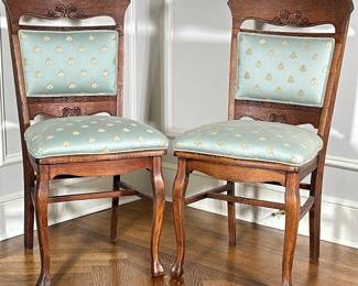 (2pc) Side Chairs with Upholstered Seats - "Bee" Pattern | Pair of antique (likely 19th century) carved wooden side chairs with light green silky upholstered back and seat cushions, dotted with yellow "bee" pattern. - h. 39 x w. 19 x d. 17 in