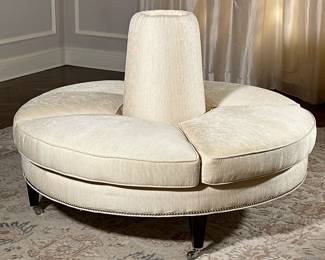 Circular Confidante Sofa | Vintage (mid-20th century) circular "confidante" sofa (designed to encourage conversation at parties) with white upholstery, four seat cushions, nailhead trim along the bottom edge, and on caster wheels for ease of movement. - h. 39 x dia. 55 in