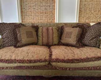 EJ Victor Bohemian Style Loveseat Sofa | EJ Victor (Morganton, North Carolina) Bohemian style loveseat, designed by Carol Hicks Bolton as indicated by the tag underneath, features two fringed seat cushions and several reversible throw pillows of varying patterns. Includes all pillows. - h. 34 x l. 80 x d. 43 in