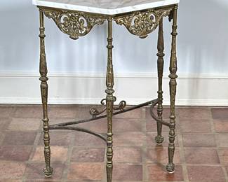 Brass & Marble Top Small Console Table | Vintage (1920s) brass and marble console table, featuring a polished marble top, ornate carved legs, and detailed scrollwork apron. - h. 30 x w. 25 x d. 12 in