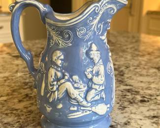 After Duncan Ceramics, Porcelain Pitcher | Vintage porcelain pitcher, likely a Duncan Ceramic (Fresno California) mold piece, featuring a relief design of figures. - h. 7.25 x w. 6.25 x d. 3.75 in