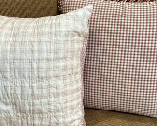 (2pc) Throw Pillows - Gingham & Plaid | Two square throw pillows, one with red and green gingham pattern and a piped/twisted trim, the other with white and pink plaid pattern on linen-like fabric. - h. 16 x w. 16 in