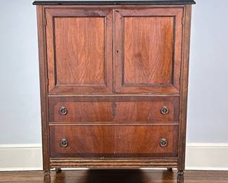 Atlas Furniture Co. Chest of Drawers | Vintage Atlas Furniture Company (Jamestown, New York) walnut chest of drawers, featuring a cabinet top with recessed paneled doors and keyed entry above two full-length dovetail drawers with floral ring-pull plates, all set on caster wheels. - h. 48 x w. 32.5 x d. 21 in