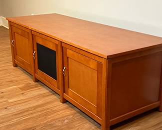Sanus "Woodbrook" Entertainment Cabinet | Sanus (Eden Prairie, Minnesota) "Woodbrook Series" cherry lowboy entertainment cabinet with MDF panels to reduce resonance, rear wire channels for cable management, and ventilated design for airflow. - h. 22 x w. 66 x d. 24 in