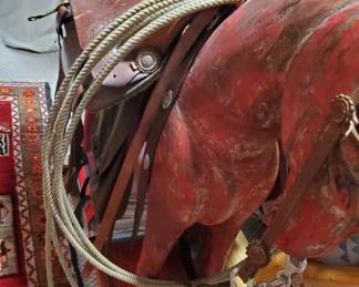 This is a HORSE with a real saddle. Gotta see it!
