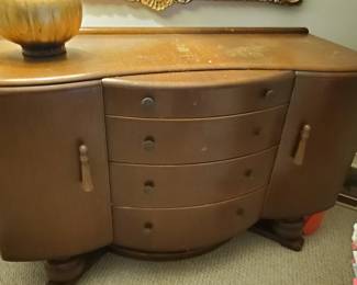 This pieces is so unusual. Look at how the drawers are bowed.