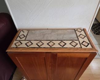 Tile top cabinet w/2 adjustable shelves~~Exterior: 31 in wide X 33 in tall X 14 in deep