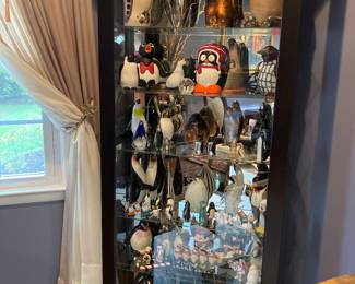 Contemporary display curio cabinet mirrored back glass shelving, five shelves with sliding door and lock. Very good condition.