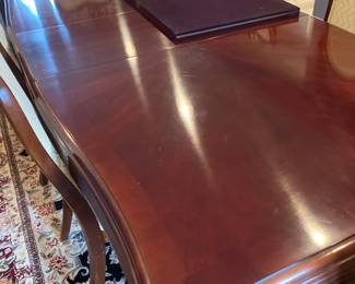 Thomasville dining room table and chair great condition  Mahogany table And six upholstered matching chairs with carving on top