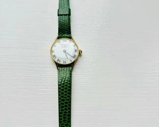 van cleef aarpels watch with green alligator band