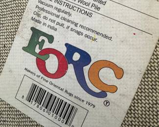 EORC round hand, tufted 100% wool pile made in India rug.