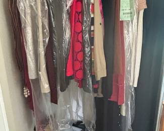 Several closets filled with ladies clothing and accessories. Many vintage pieces.