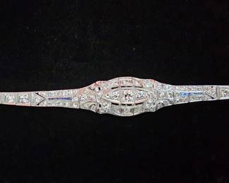 Stunning Platinum, Diamond and Sapphire  bracelet. This stunning ladies bracelet is adorned with eighty three mine cut diamonds and four thin cut sapphires. Must see ! 