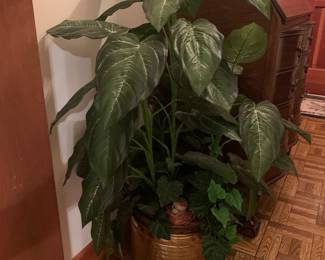 plastic plant in brass pot