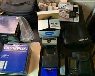 cameras and binoculars, Olympus and Minolta, Polaroid