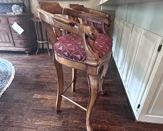 Upholstered Bar Stools with beautifully carved duck heads.