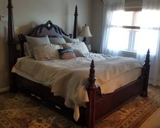 King bedroom suite: king bed; two nightstands; armoire; dresser with mirror