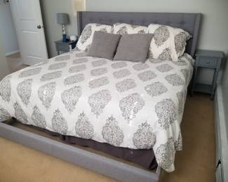 Upholstered king bed frame (currently housing two twin bed); two nightstands