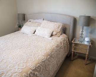 Queen bed; mirrored nightstands; table lamps