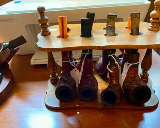 vintage pipe stands and lots of pipes