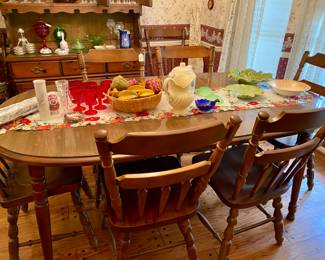 table has two leaves and 8 chairs