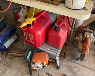 gas cans, chainsaw